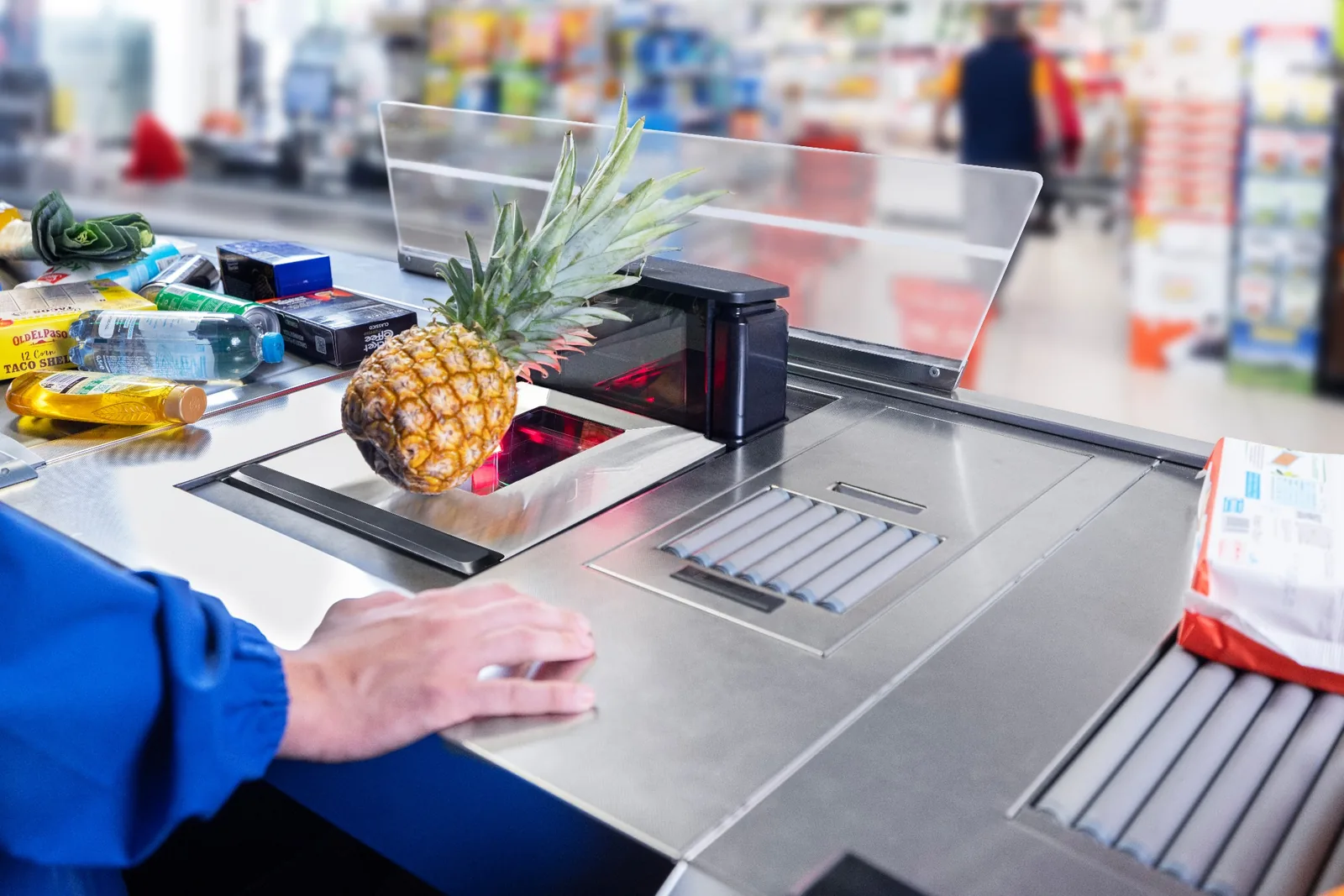 Magellan 9550i com pesagem integrada em checkout de supermercado
